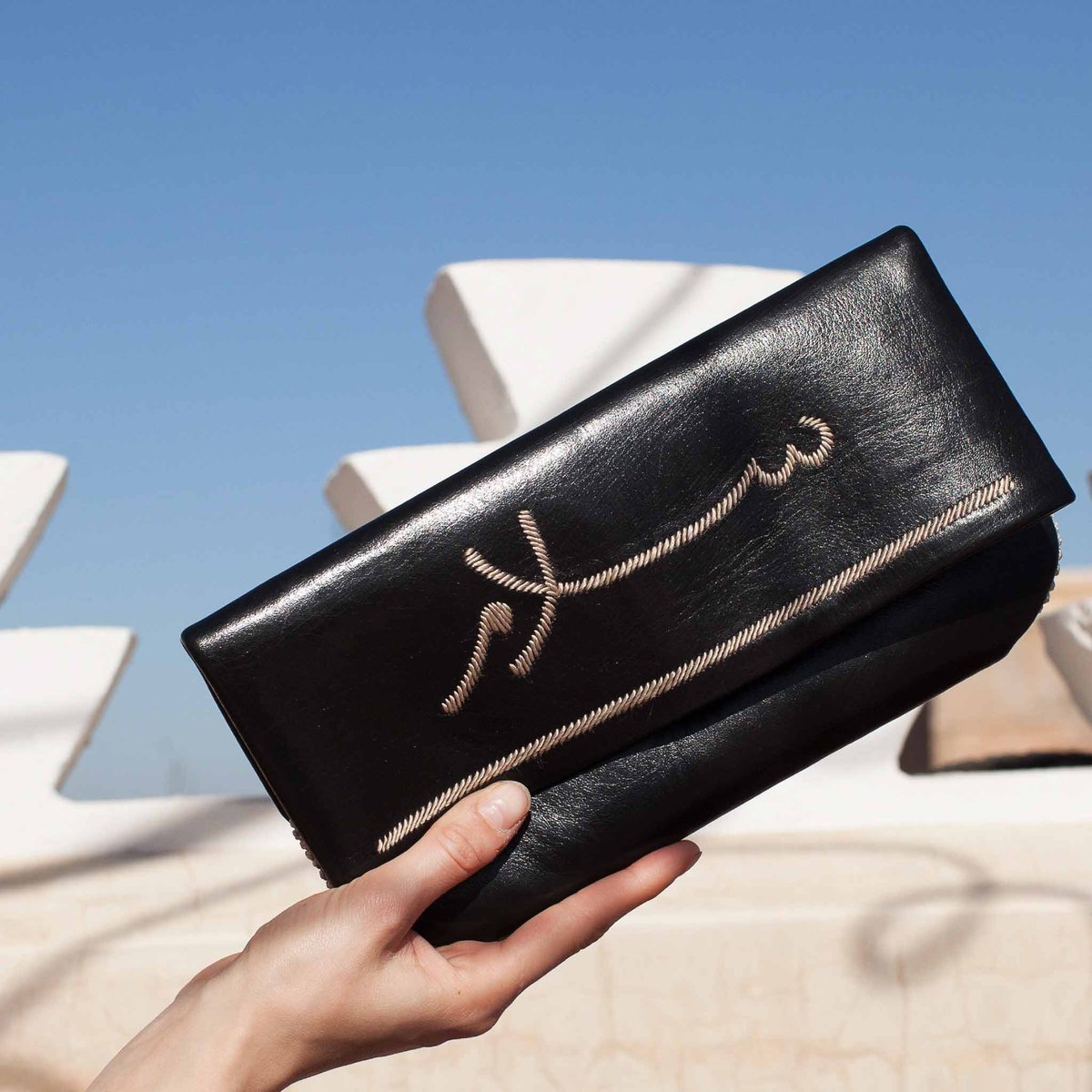 The Peace Clutch, embroidered with Salam, the Arabic word for peace