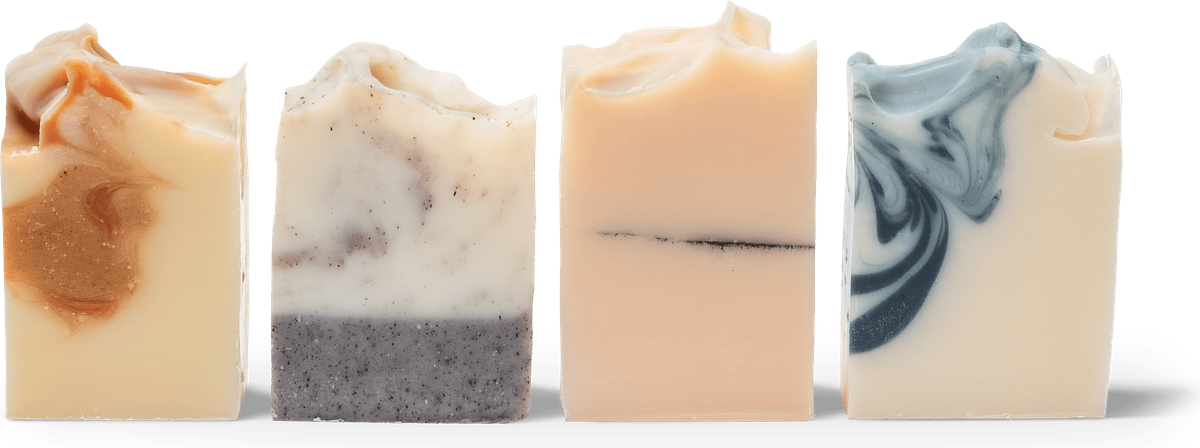 Four bars stood on end with their cut faces to the camera, each one a different colour.