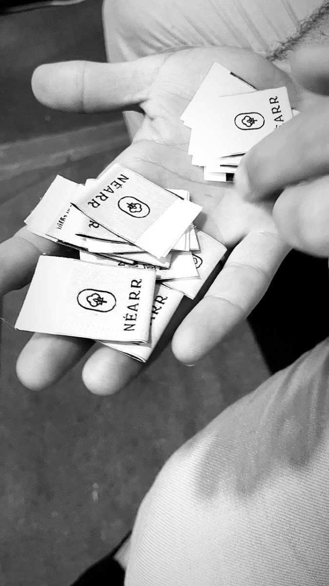 Woven labels, waiting to go into a seam.