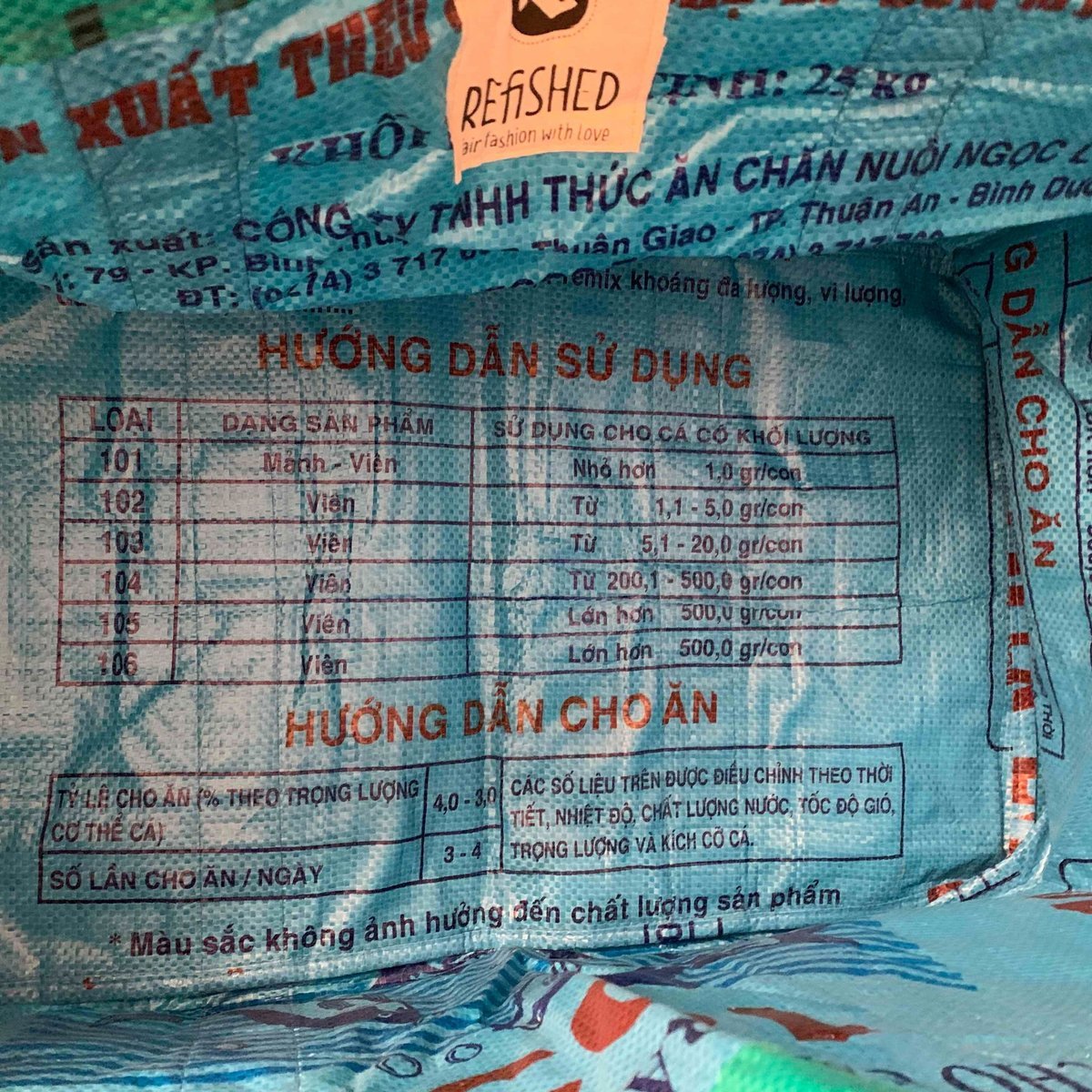 The print on a used fish-feed sack, in Vietnamese