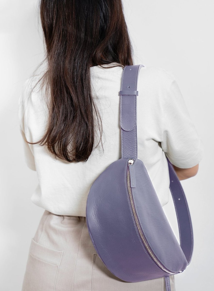 The Django in lavender leather, worn across the back.
