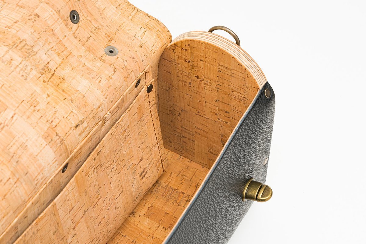 Inside a bag, cork lining against the wooden sides