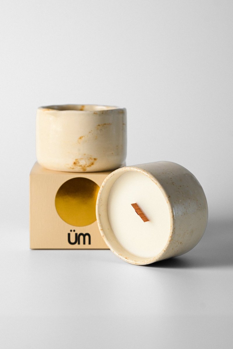 A gingerbread-scented candle poured into a glazed stoneware mug