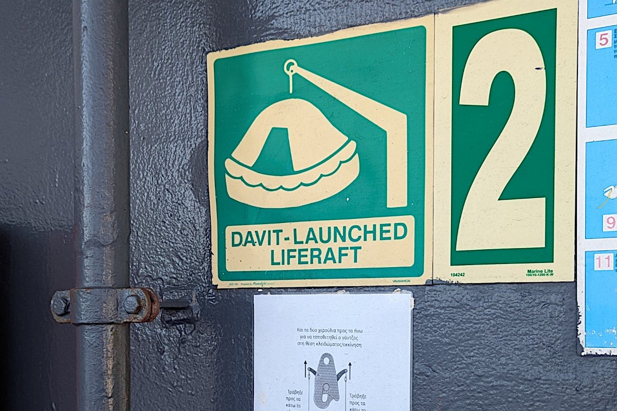 A ferry sign marking life raft station 2, the raft launched by davit