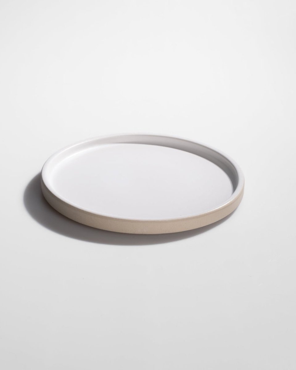 A RAW plate, glazed across the face and left bare at the rim and sides.