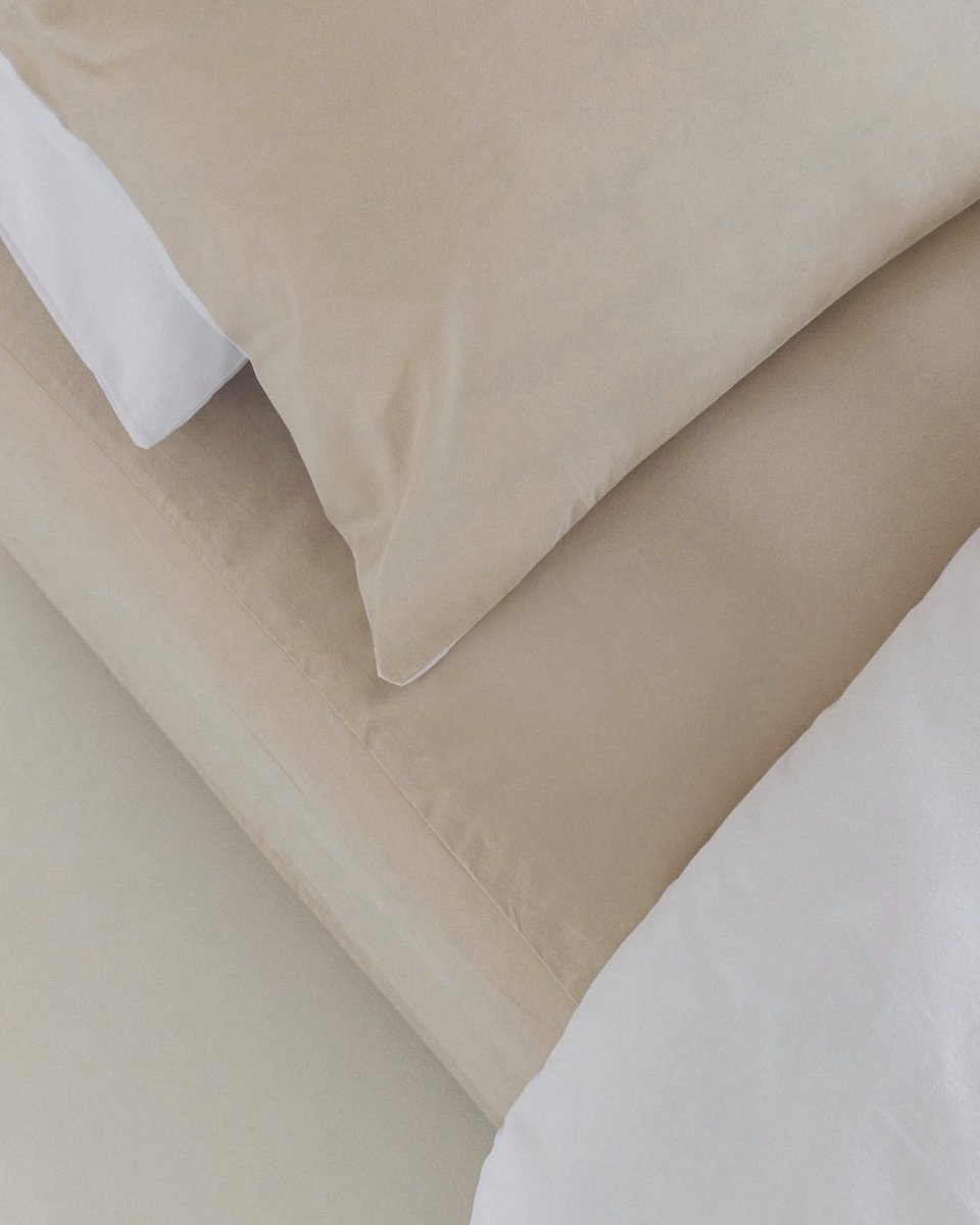 The beige colourway, folded back over white.