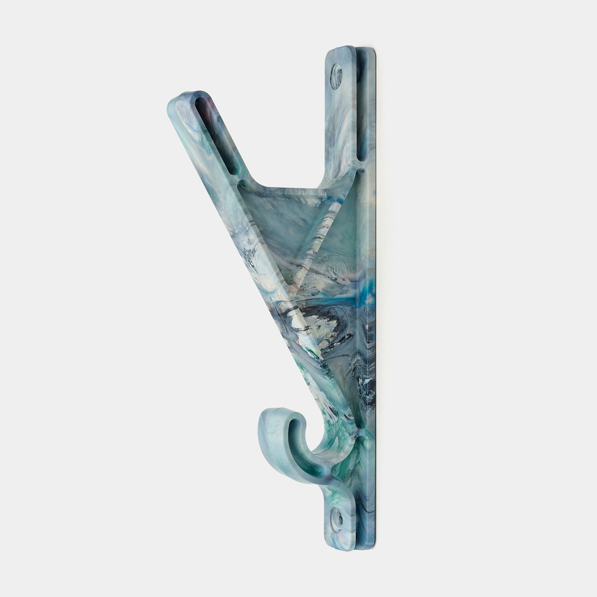 The HKN wall hook in Colourful Grey, cast from recycled plastic, its surface a marbled swirl of blues and greens