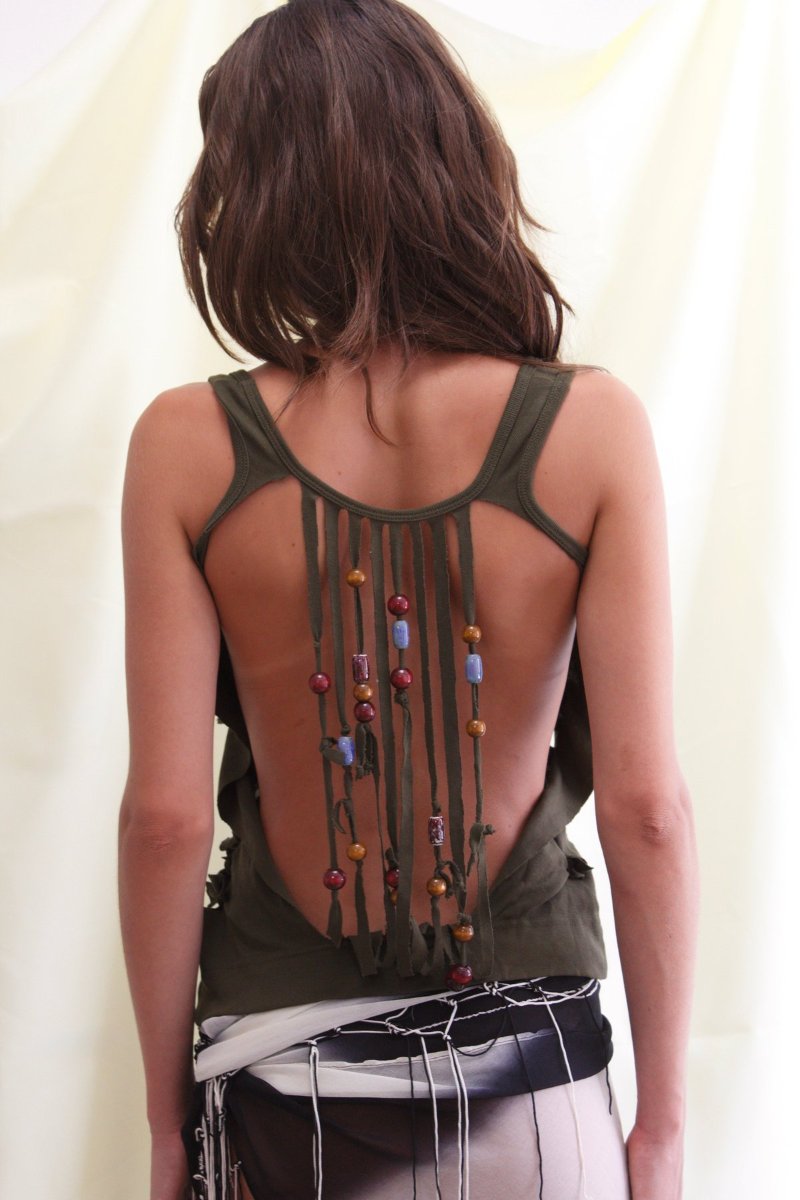 Cords strung with coloured beads, hanging down the open back.